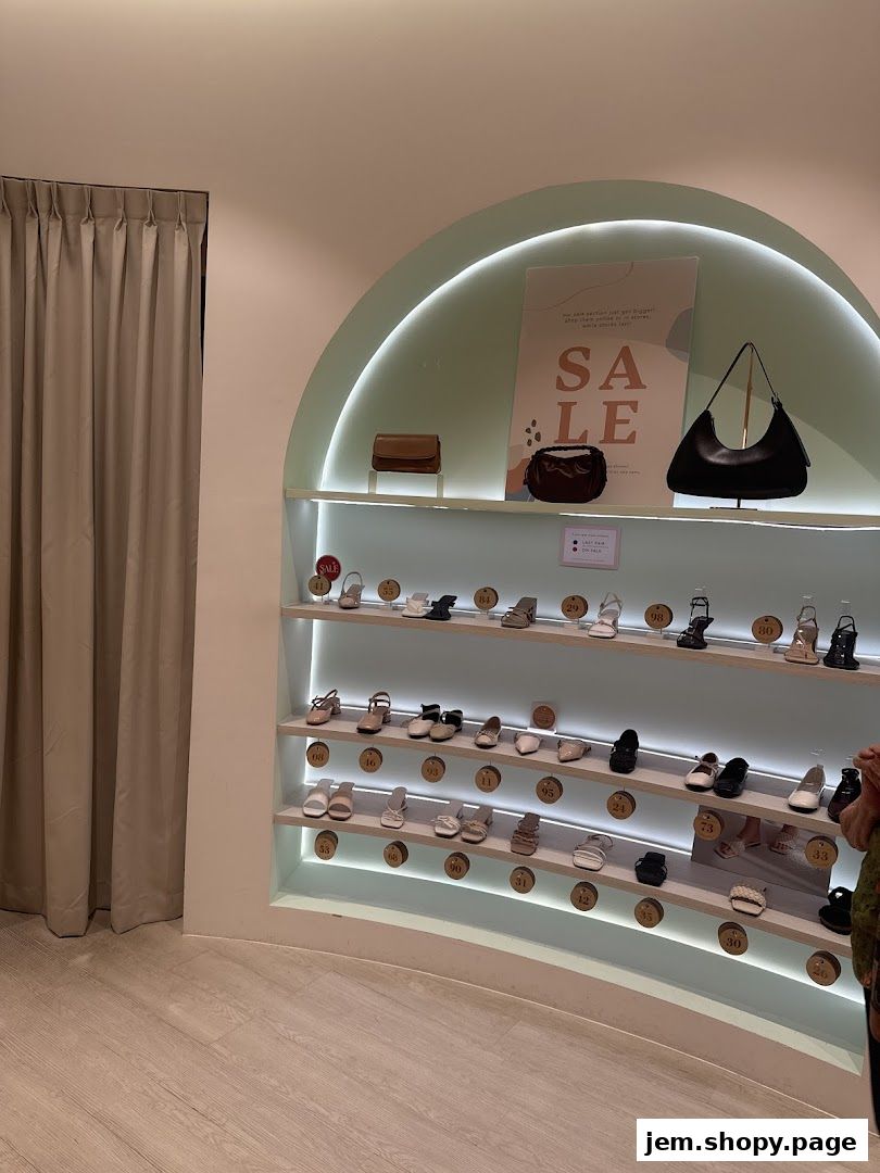 Interior view of Sunday Staples shoe store with shoes and handbags displayed on shelves.