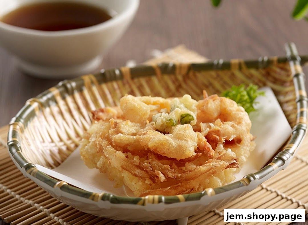 A close-up of crispy tempura shrimp and vegetables served in a decorative basket.