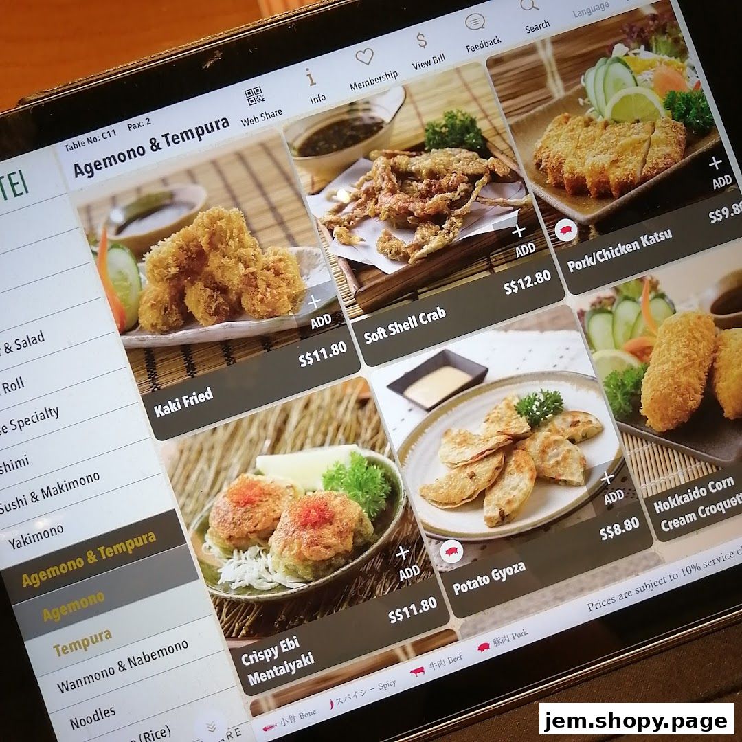 A digital menu displaying various Japanese fried dishes and appetizers from Sushi Tei.