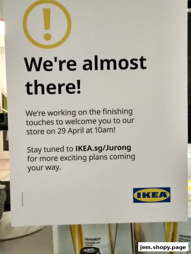 A sign announcing the grand opening of an IKEA store on April 29th.