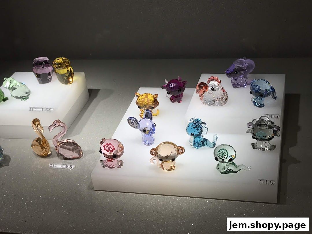 A display of sparkling Swarovski crystal figurines in various animal shapes.