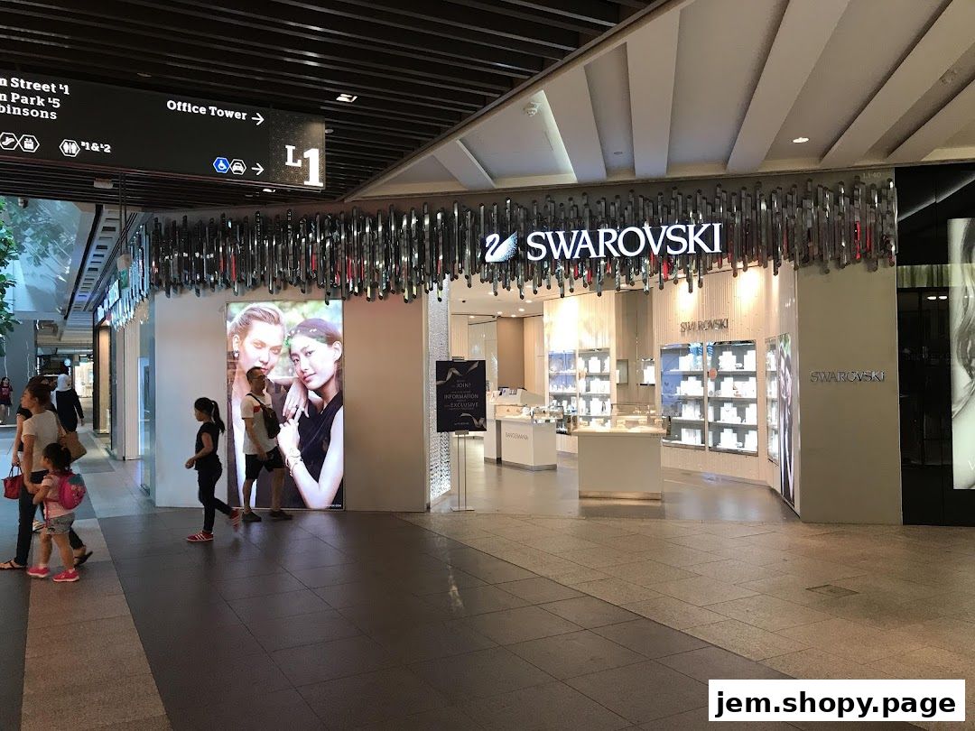 The exterior of a Swarovski jewelry store with displays of sparkling items and a large advertisement.