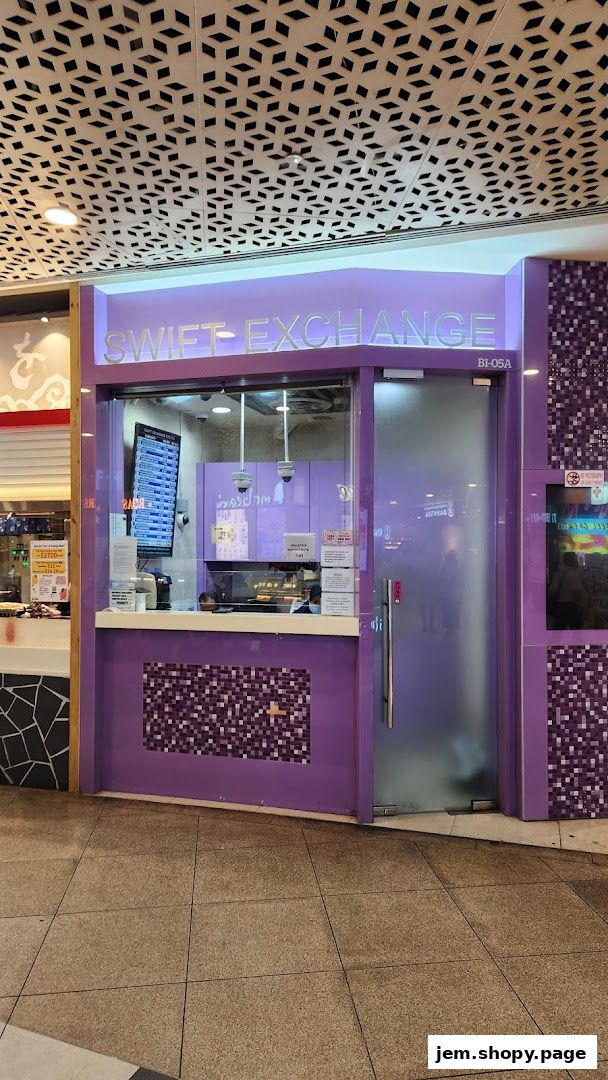 The Swift Exchange shop front with purple accents and a digital display of exchange rates.