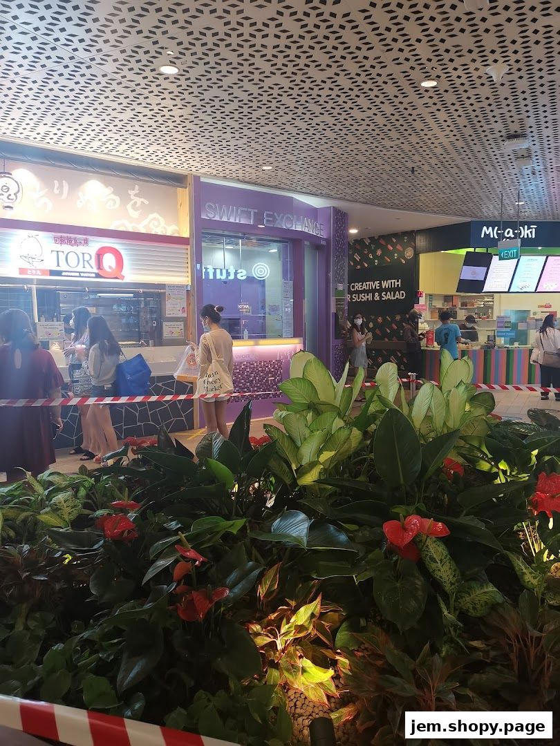 The Swift Exchange shop front with a purple facade and a queue of customers.