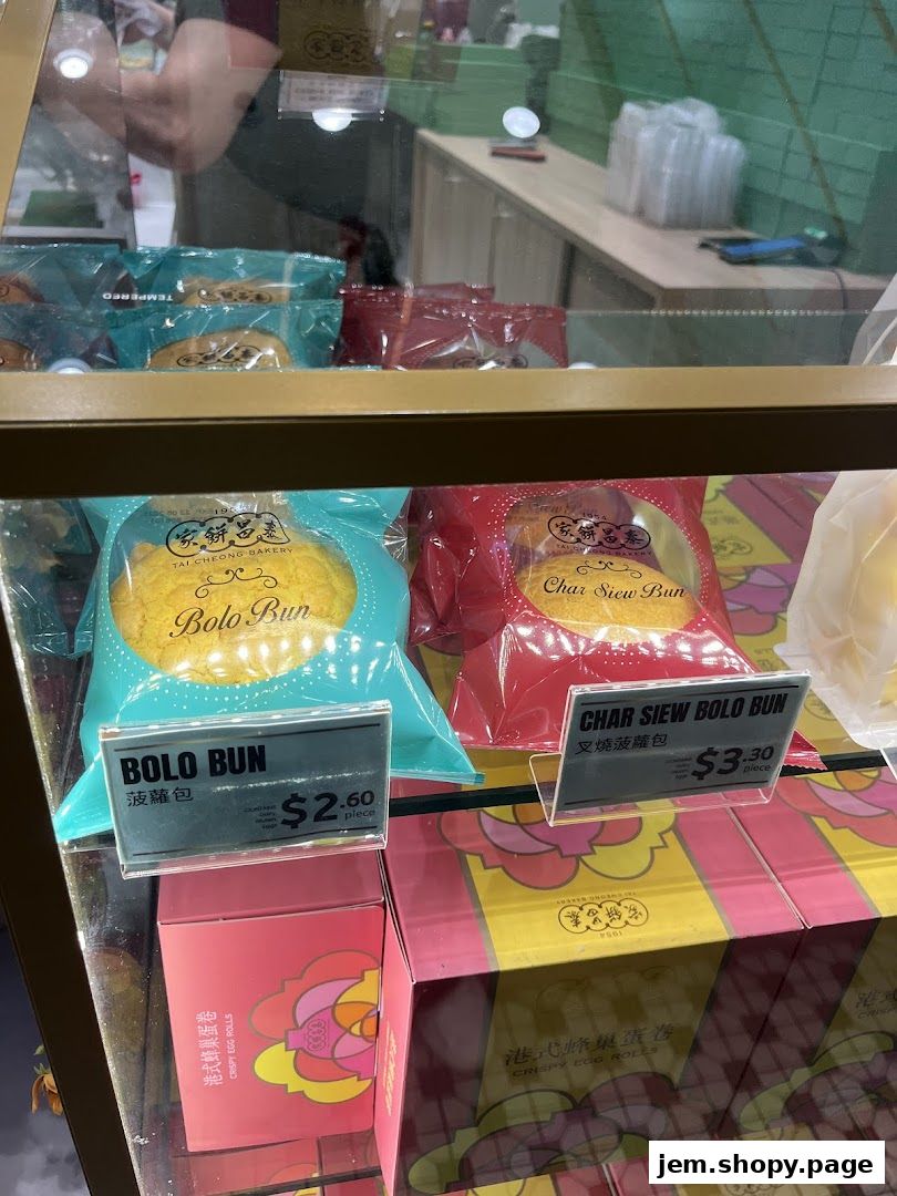 Display case at Tai Cheong Bakery featuring Bolo Buns and Char Siew Bolo Buns.
