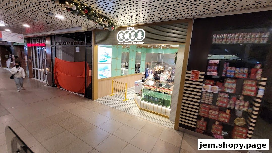The exterior of Tai Cheong Bakery, showcasing its entrance and display of baked goods.
