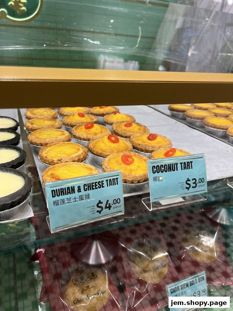 A display of freshly baked tarts and buns at Tai Cheong Bakery.