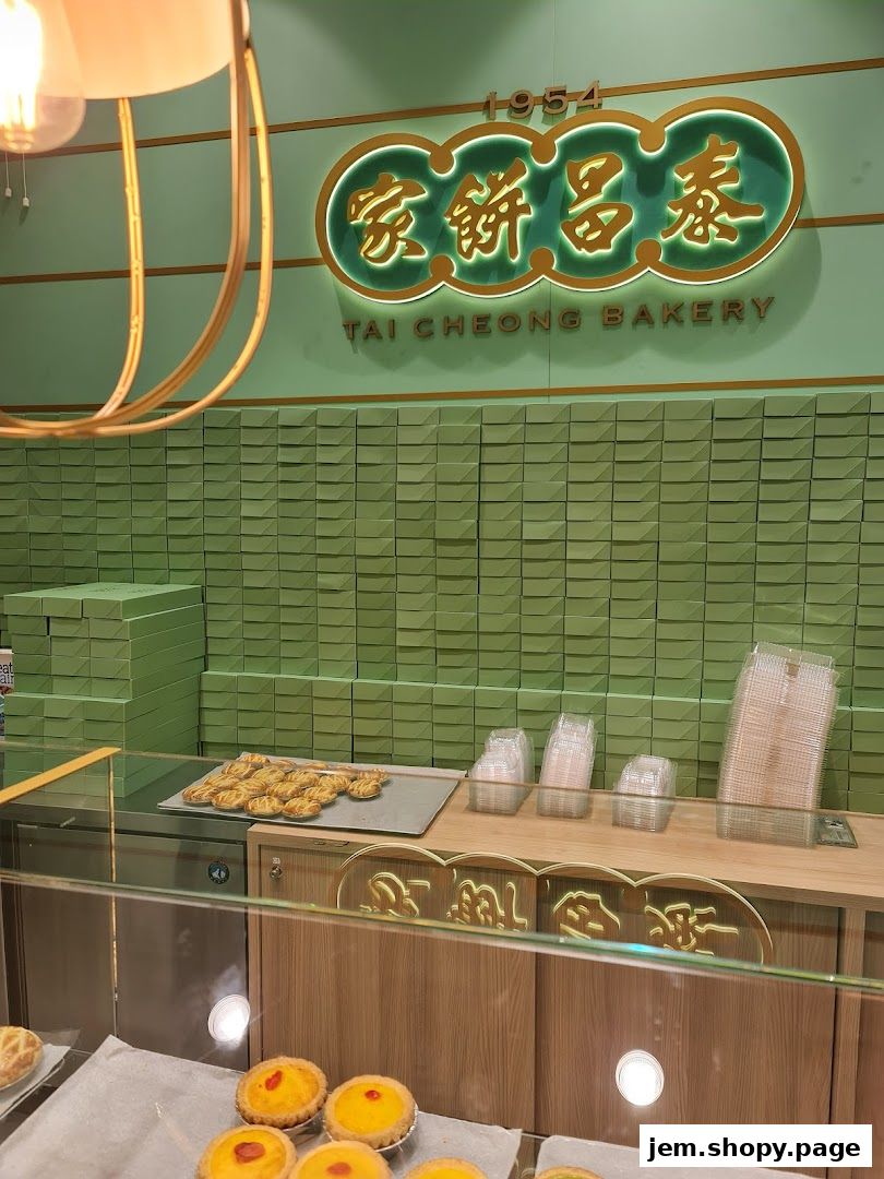 Interior view of Tai Cheong Bakery with egg tarts and pastries displayed.