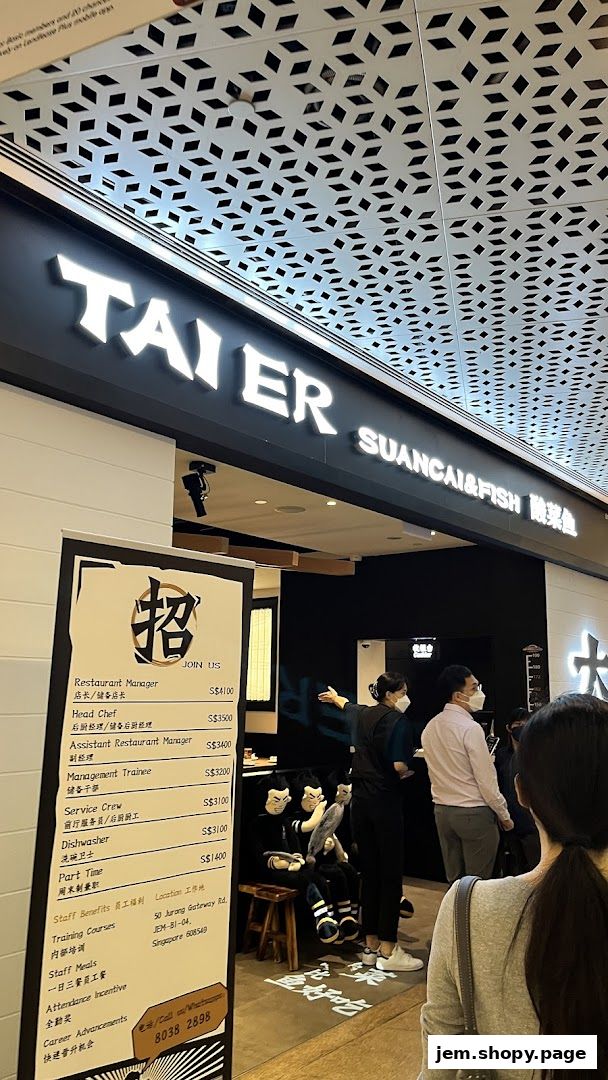 The exterior of the TAI ER SUANCAI&FISH restaurant with a recruitment sign.