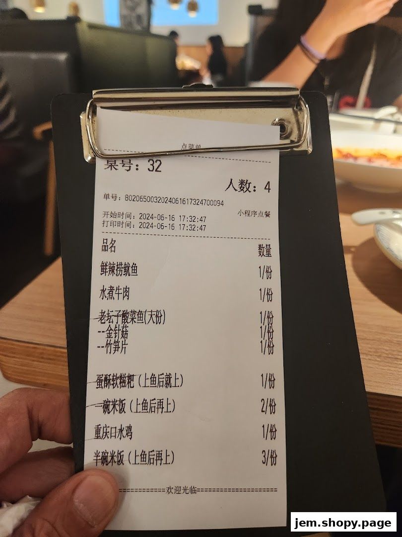 A receipt from TAI ER JEM showing a list of ordered food items and quantities.