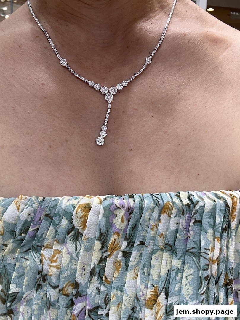 A diamond necklace with a floral pattern dress.