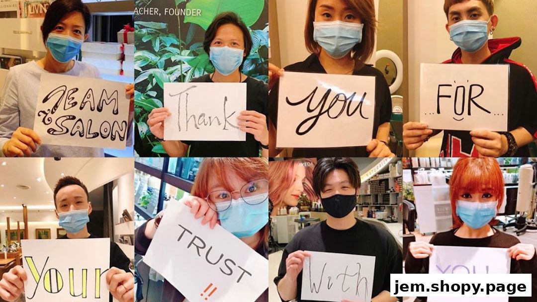 Team members of Team Salon Jem Aveda express gratitude and trust through signs.