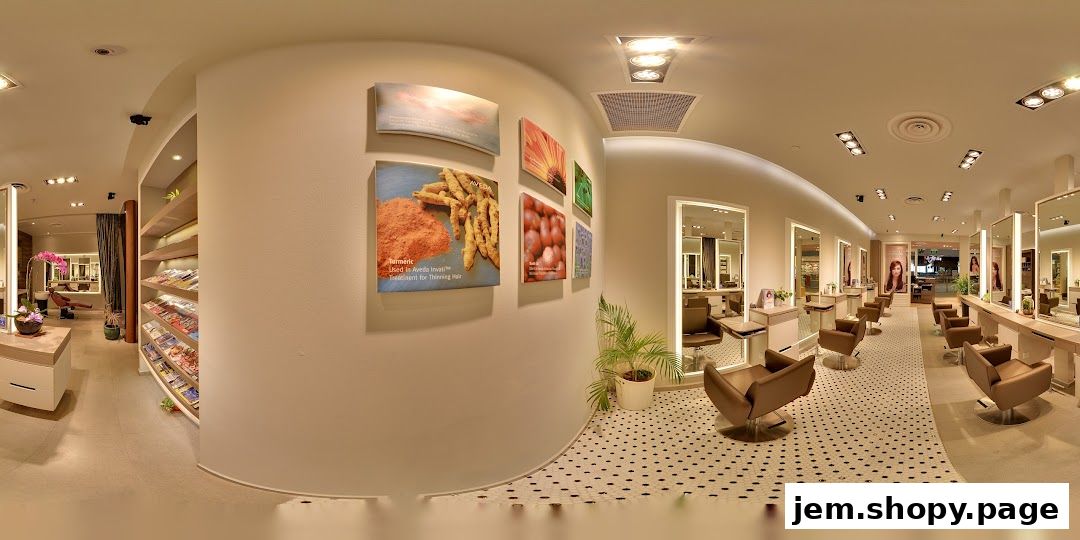 Interior view of a modern hair salon with styling chairs, mirrors, and product displays.
