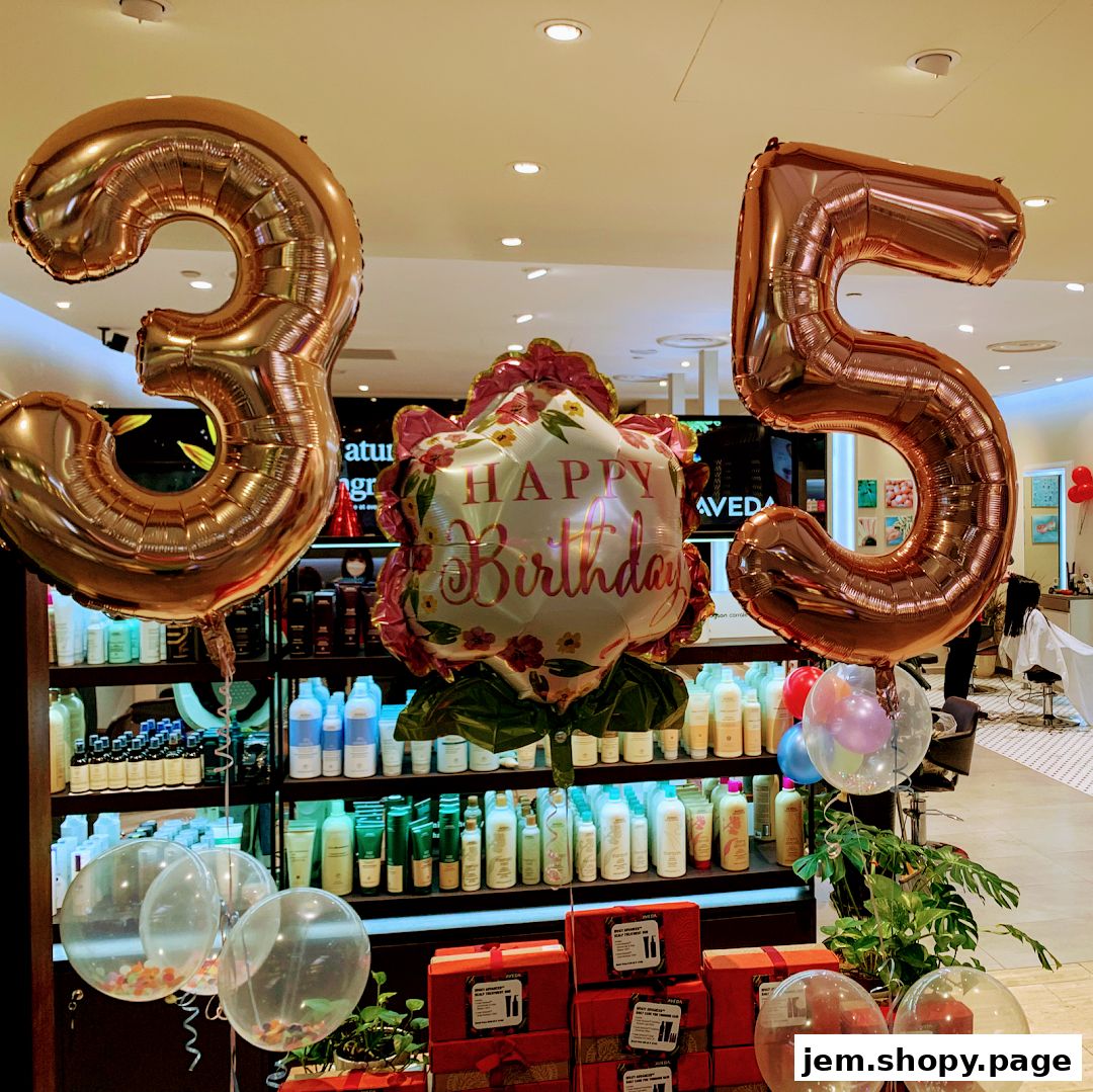 Balloons celebrating a 35th birthday are displayed in front of shelves stocked with Aveda products.