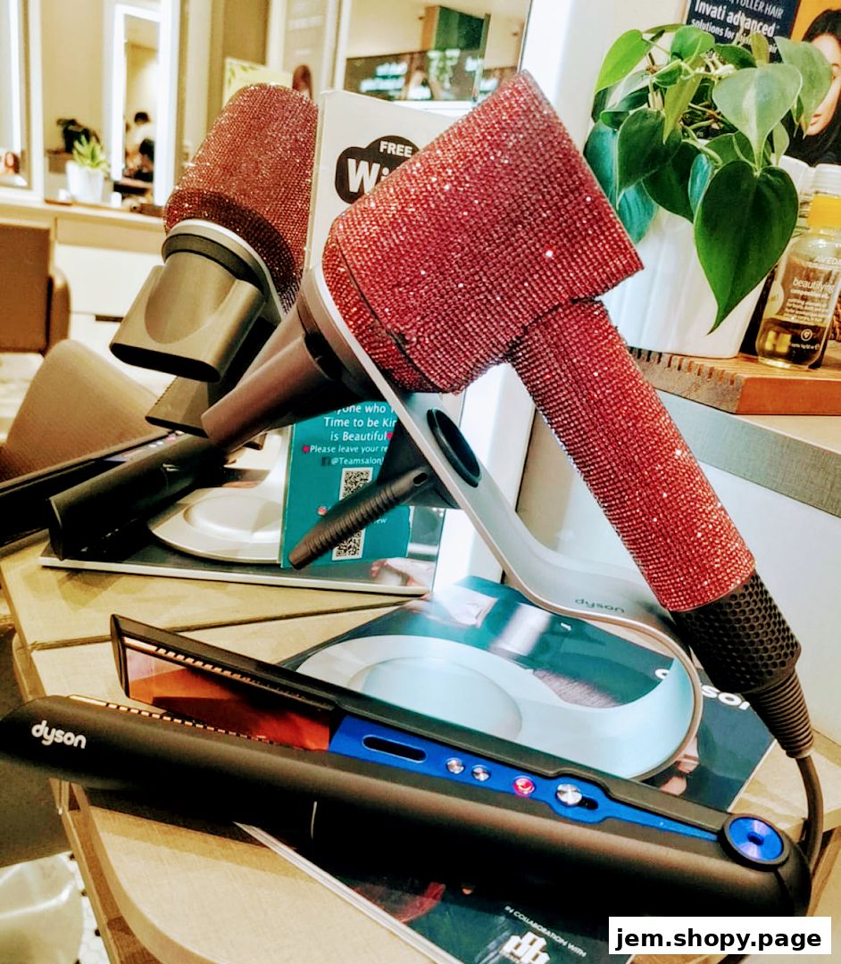 Dyson hair dryers and straighteners, one dryer is encrusted with red rhinestones.