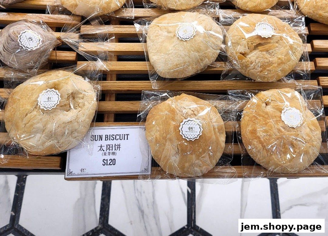 A display of freshly baked sun biscuits, individually wrapped and priced.