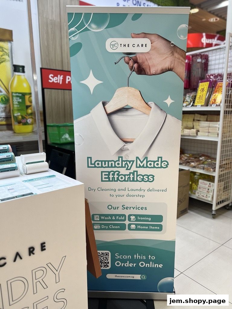 A pull-up banner for The Care Laundry, advertising effortless dry cleaning and laundry services.