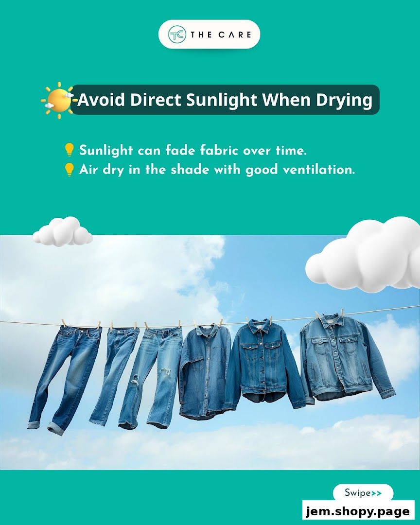 Denim clothes drying on a clothesline against a blue sky with clouds.