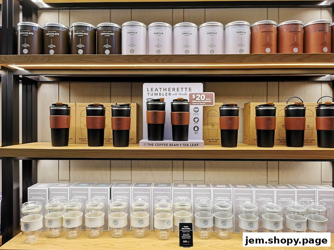 Shelves display coffee and tea products, tumblers, and glass cups at The Coffee Bean & Tea Leaf.