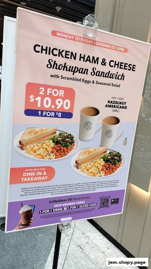 A promotional sign for The Coffee Bean & Tea Leaf featuring a sandwich and coffee combo.