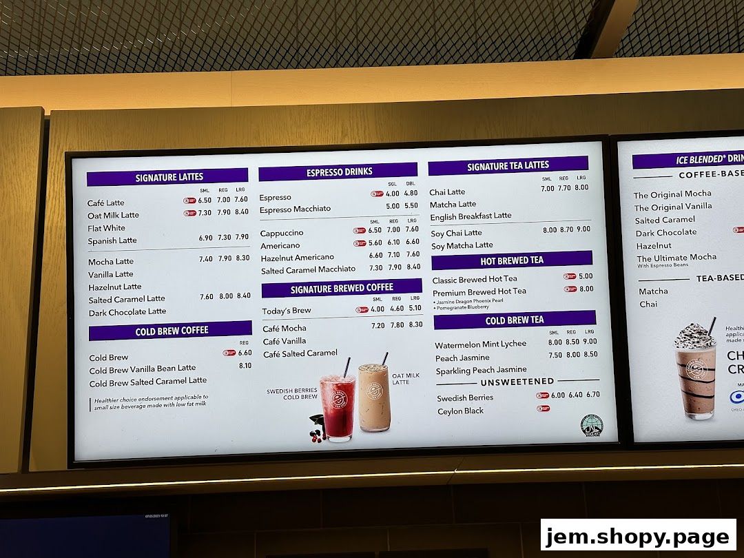 A digital menu board displaying various coffee and tea beverages with prices.