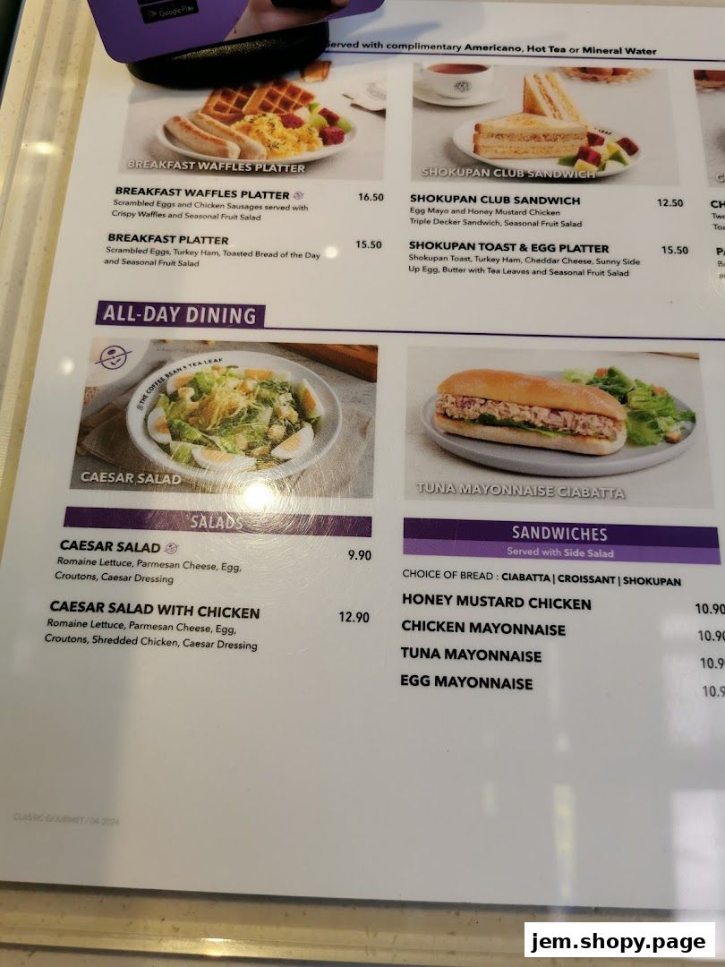 A menu from The Coffee Bean & Tea Leaf featuring breakfast platters, salads, and sandwiches.