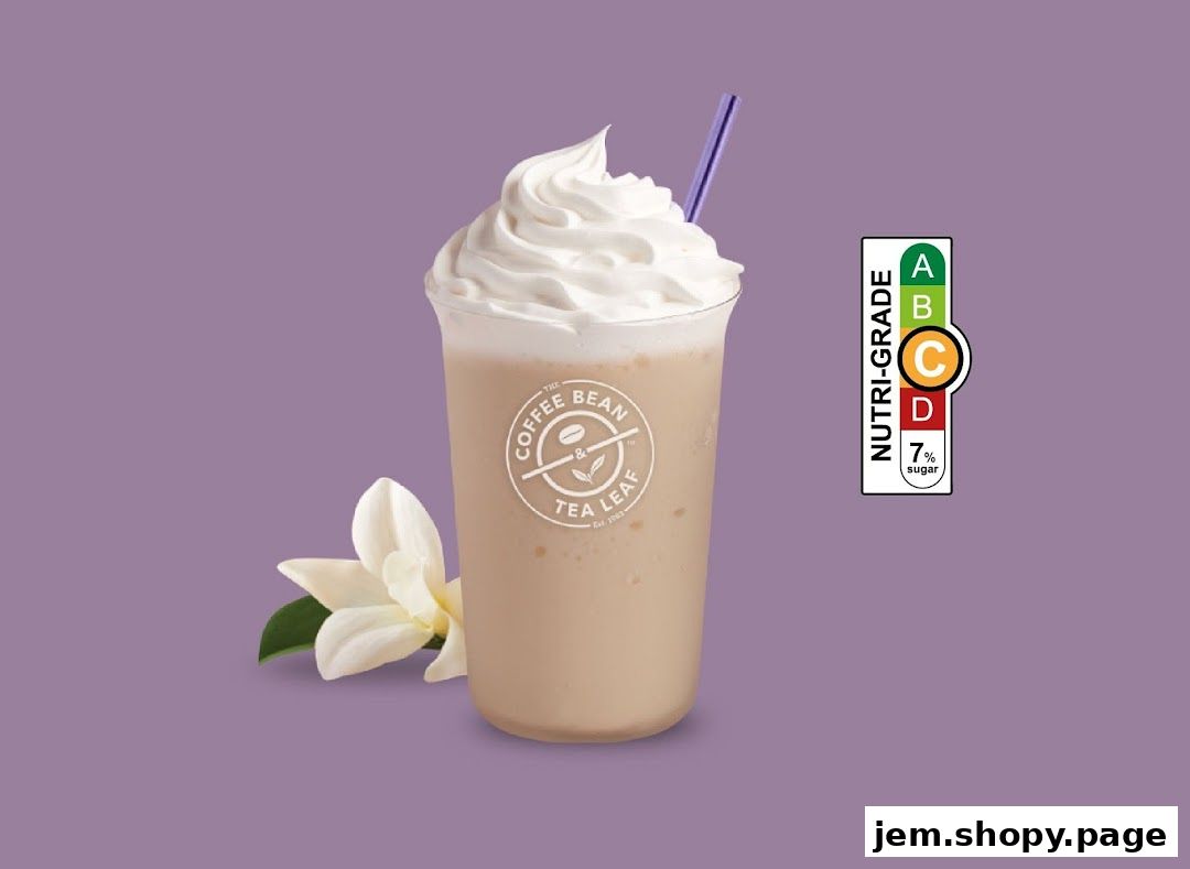 A creamy beverage with whipped cream and a straw, next to a flower.