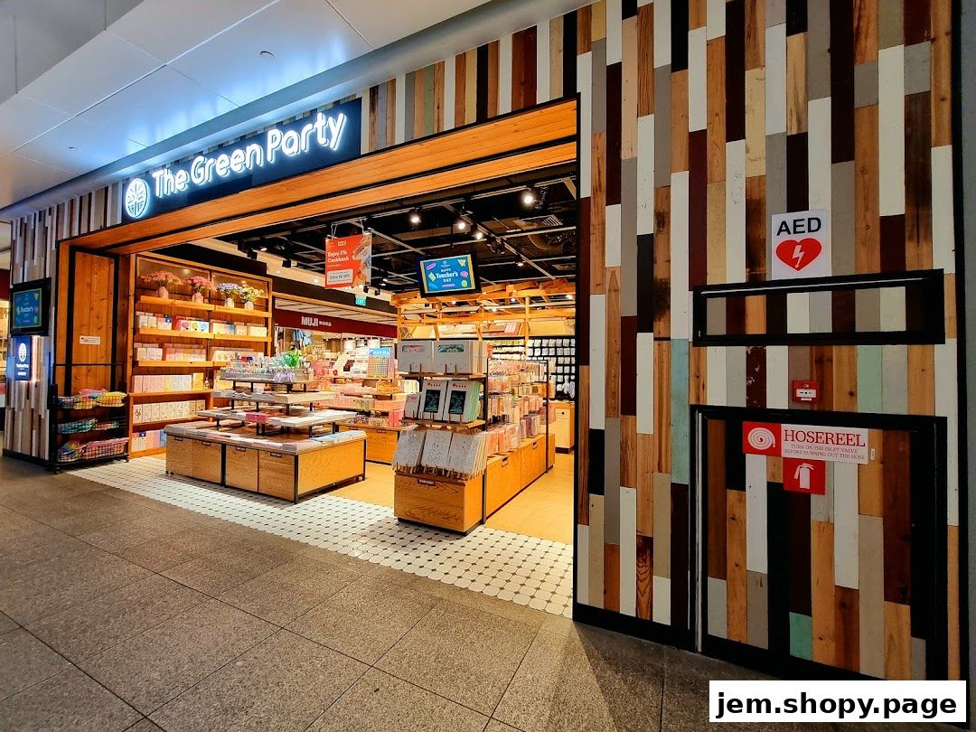 The Green Party shop entrance with shelves stocked with various items and a colorful wooden exterior wall.