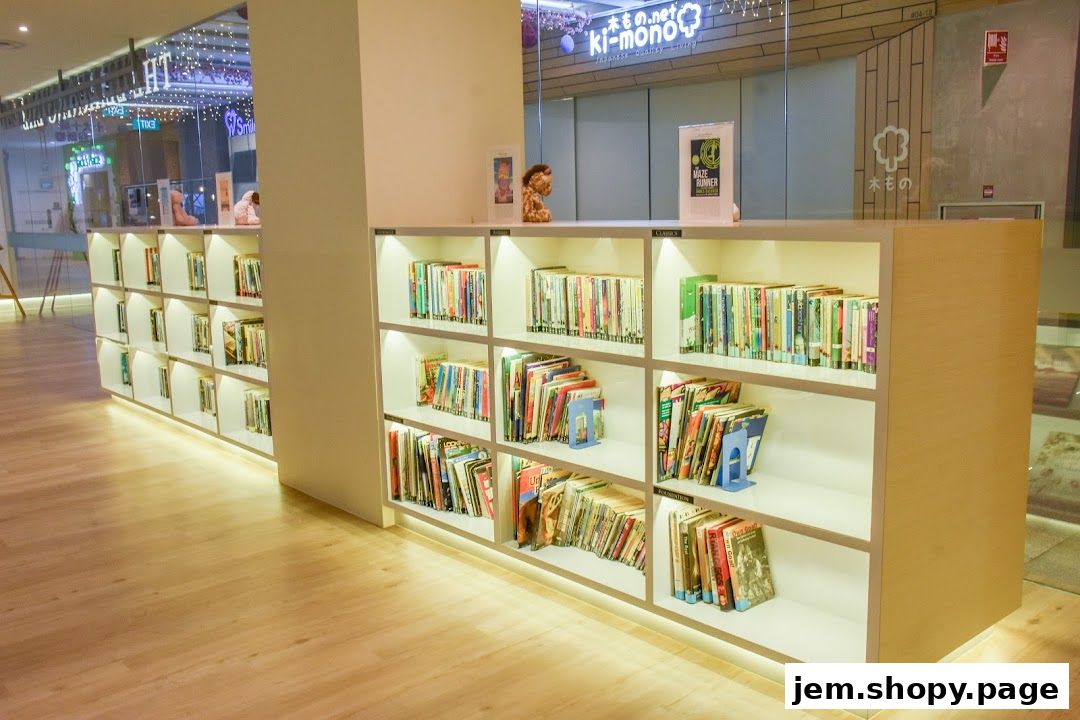 Interior view of The Learning Lab JEM, showcasing bookshelves filled with books and educational materials.