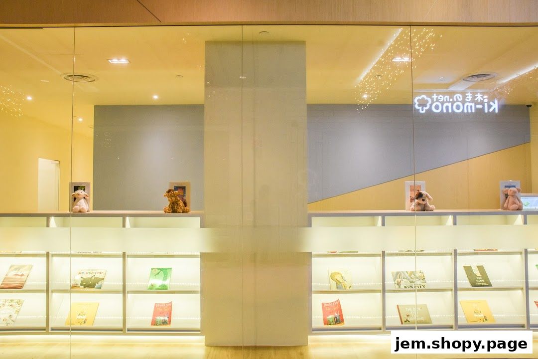 A brightly lit shop interior with shelves displaying books and plush toys.