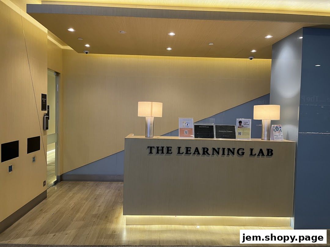 The reception counter of The Learning Lab with lamps and informational signs.