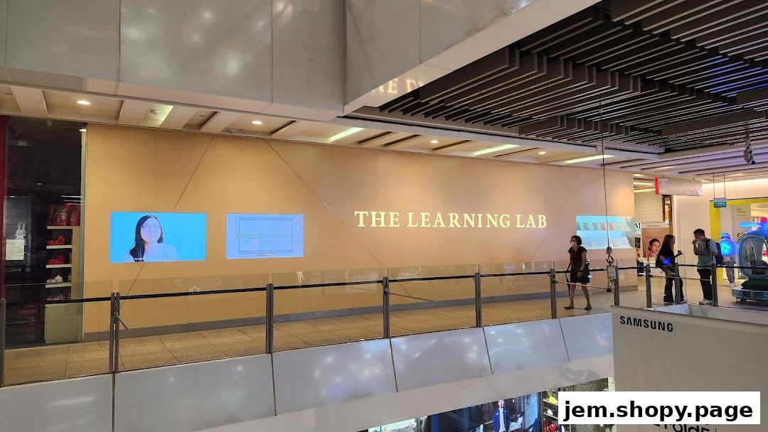 The Learning Lab storefront with digital displays and people browsing.