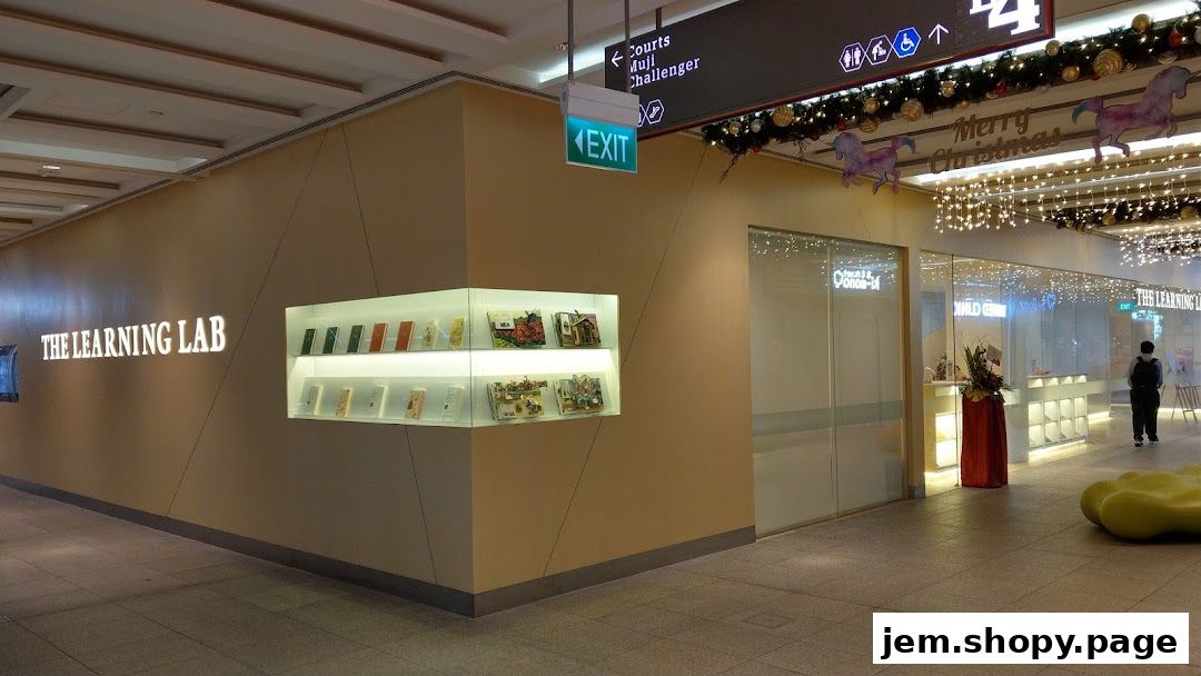 The exterior of The Learning Lab shop with illuminated signage and display shelves.