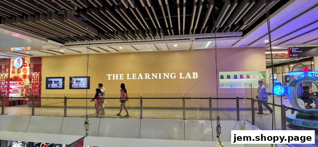 The Learning Lab store entrance with people walking by and a children's ride.