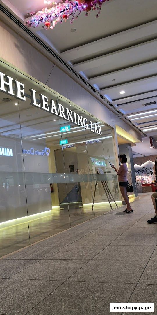 The exterior of The Learning Lab shop with a person standing outside.