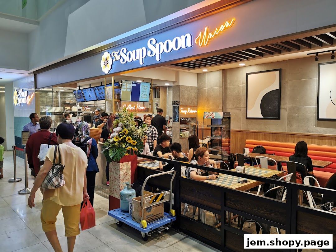The Soup Spoon Union shop front with customers queuing and dining inside.