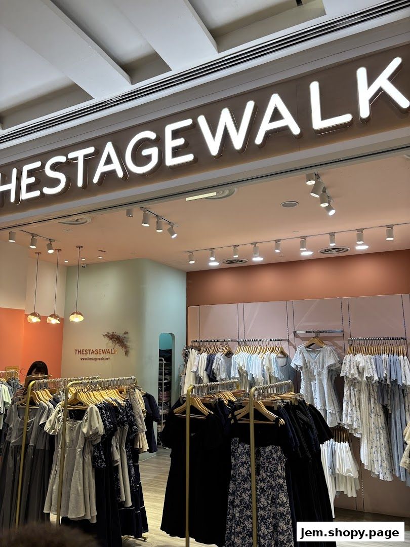 The Stage Walk clothing store entrance with dresses displayed on racks.