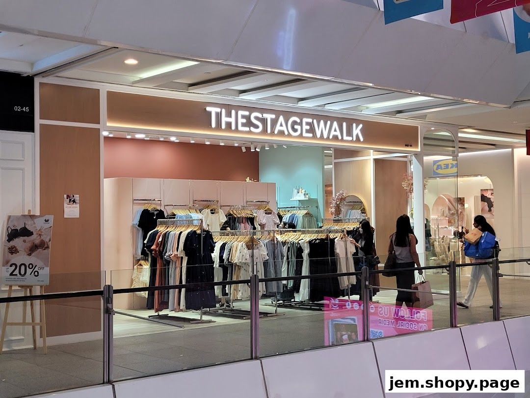 The Stage Walk clothing store entrance with racks of apparel and a 20% off sign.