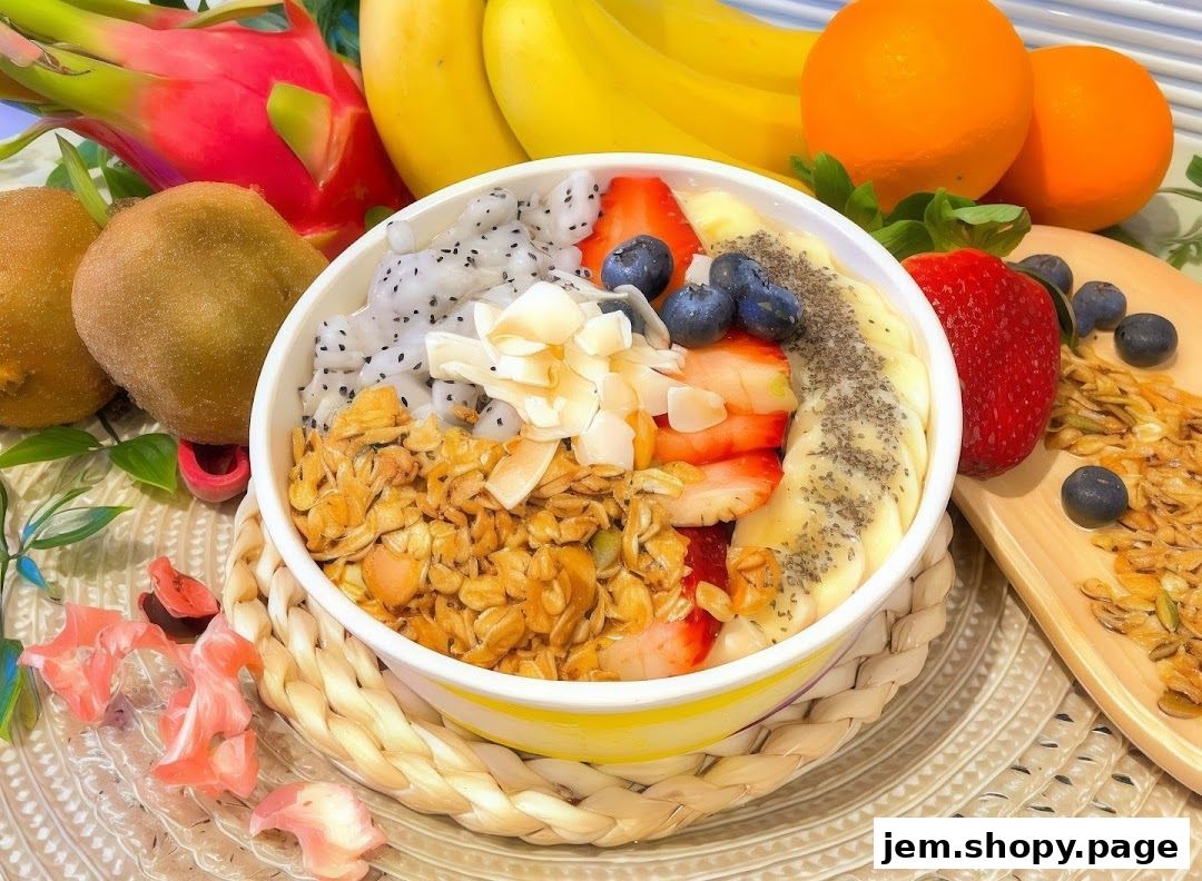 A vibrant açaí bowl filled with fruits, granola, and coconut flakes, surrounded by fresh fruits.