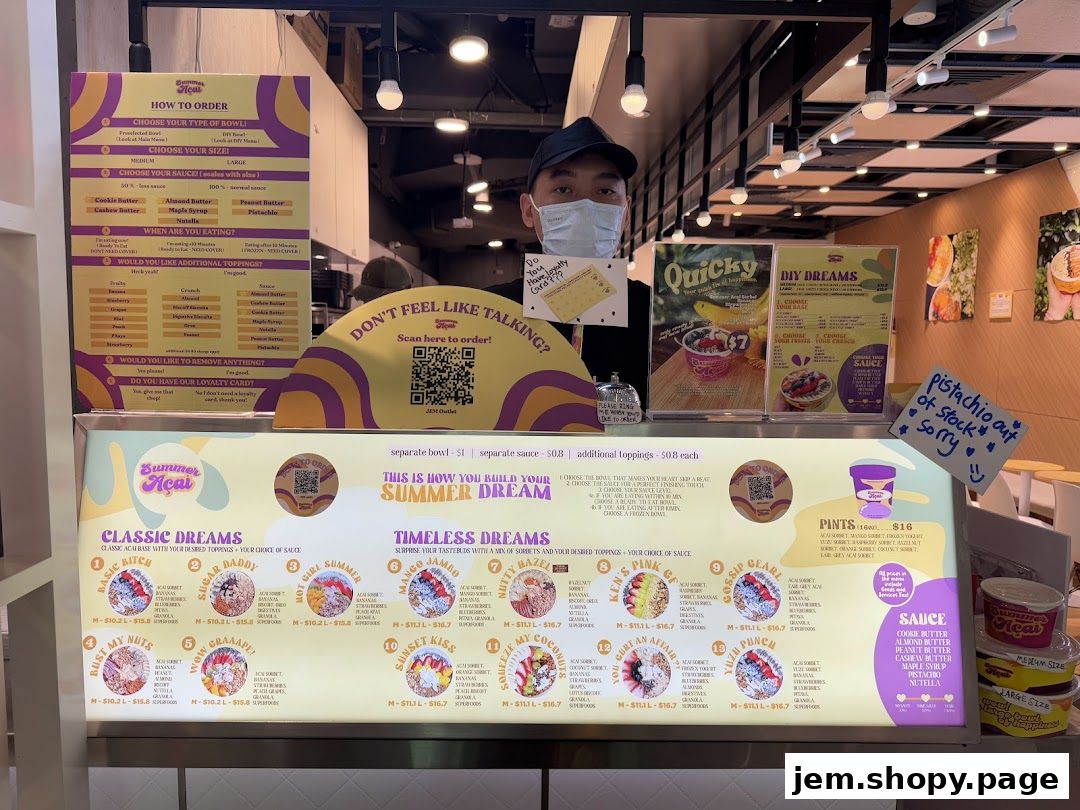 A display menu for Summer Açaí showing various bowl and pint options with toppings and sauces.