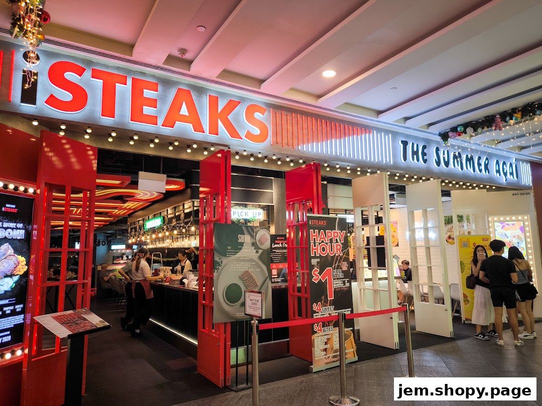 The Summer Açaí and iSteaks shop front with bright signage and promotional posters.