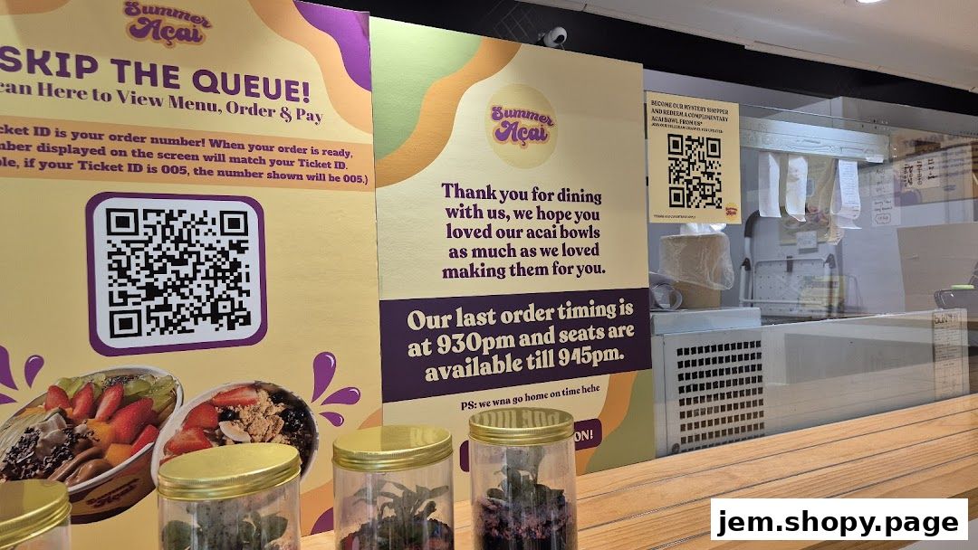 Signage at Summer Açaí Jurong East JEM with QR codes and ordering information.