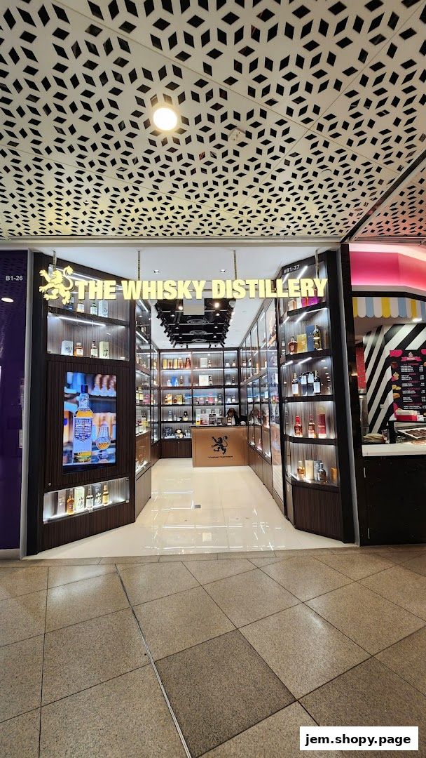 The entrance to 'The Whisky Distillery' shop, showcasing a wide selection of whiskies.