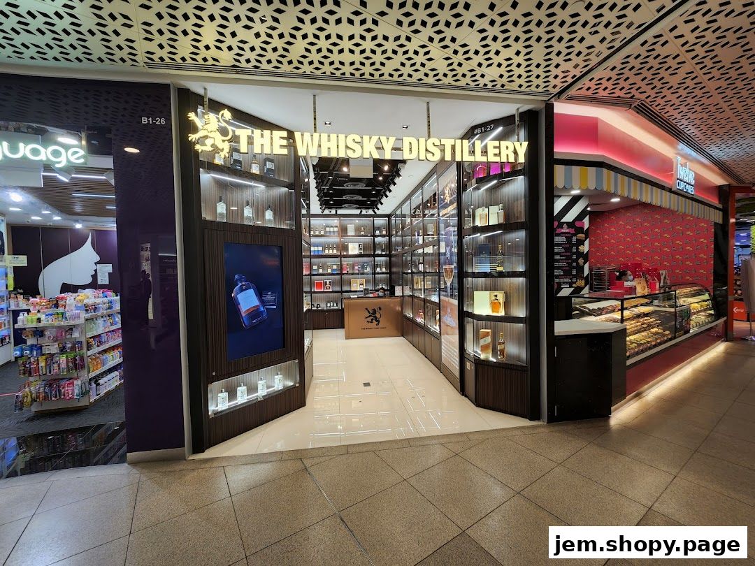 The entrance of 'The Whisky Distillery' shop, showcasing a wide selection of bottles on shelves.
