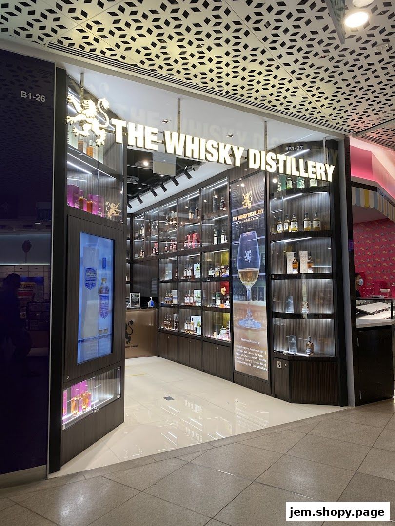 The entrance of 'The Whisky Distillery' shop, showcasing a wide selection of bottles on display.