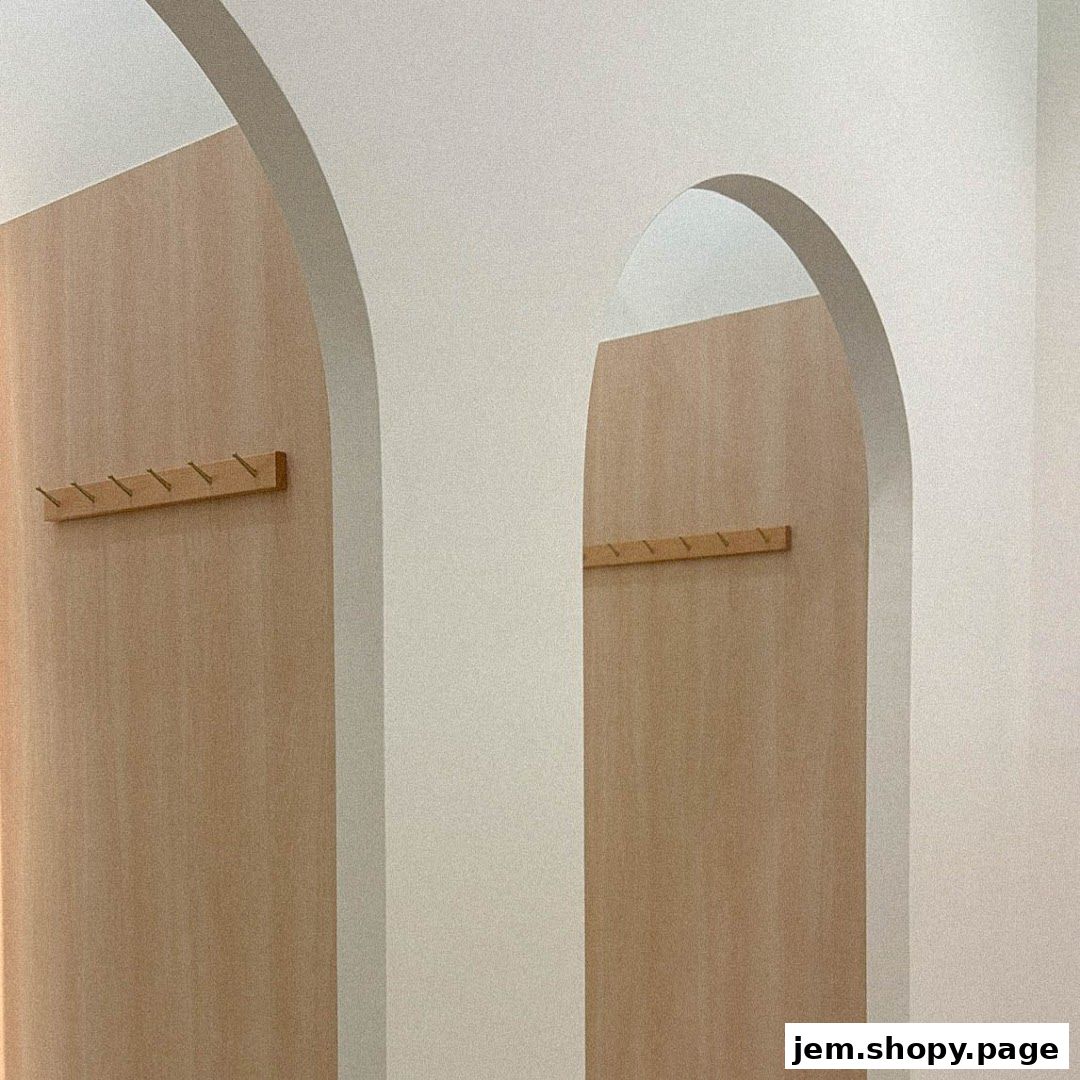 Interior shot of The Willow Label JEM showing arched doorways and wooden paneling with hooks.