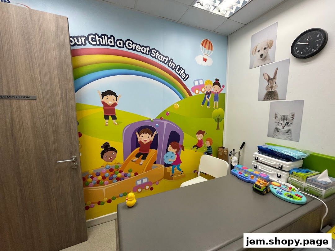 A pediatric clinic treatment room with colorful wall art and child-friendly decor.