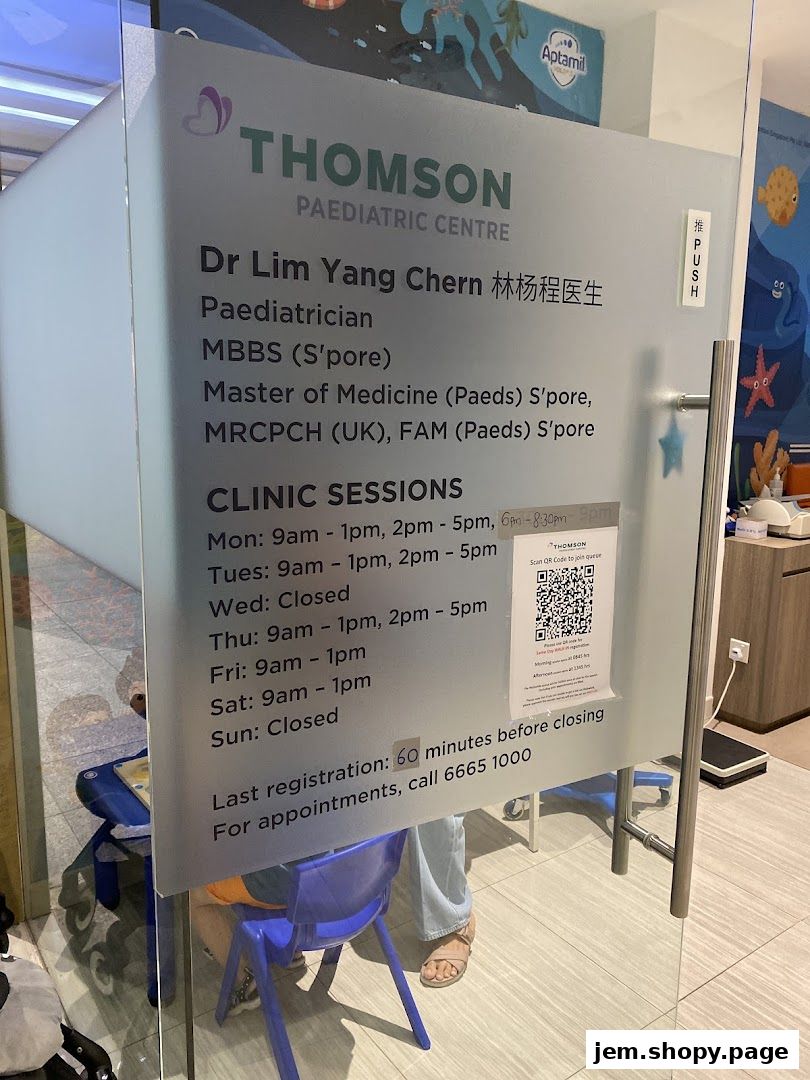 Glass door of Thomson Paediatric Centre with clinic hours and doctor's qualifications.