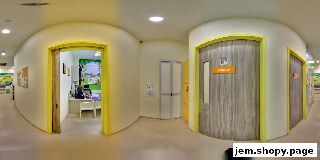Interior view of a pediatric clinic with colorful murals and a washroom sign.