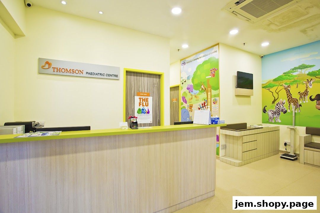 Reception area of a pediatric clinic with colorful animal murals and a check-in counter.